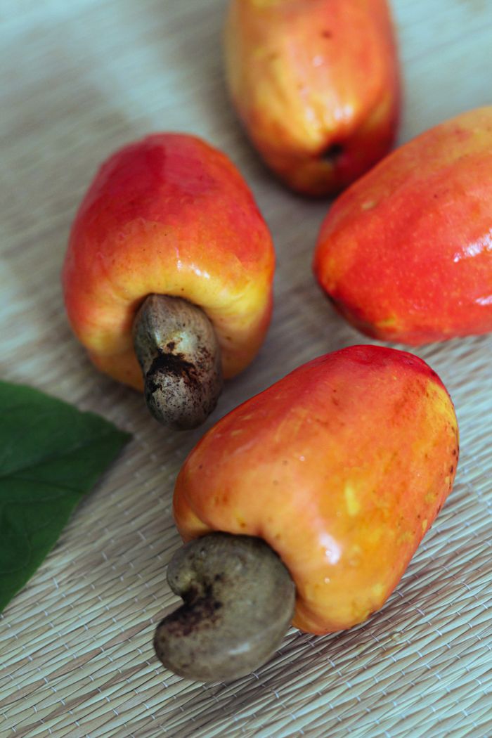 Close-up of vibrant cashew fruits showcasing natural textures and vibrant colors.